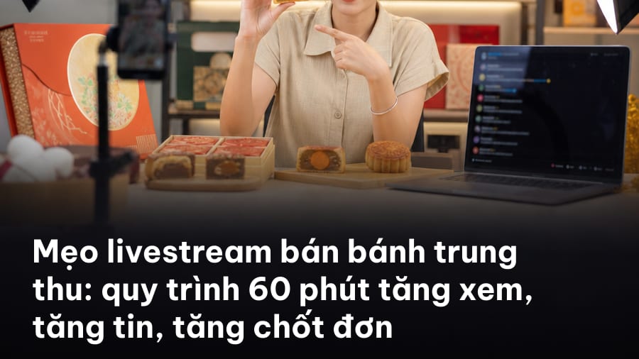 Người bán cầm hộp bánh trung thu trước điện thoại trên tripod, bối cảnh đèn ring, minh hoạ mẹo livestream bán bánh trung thu